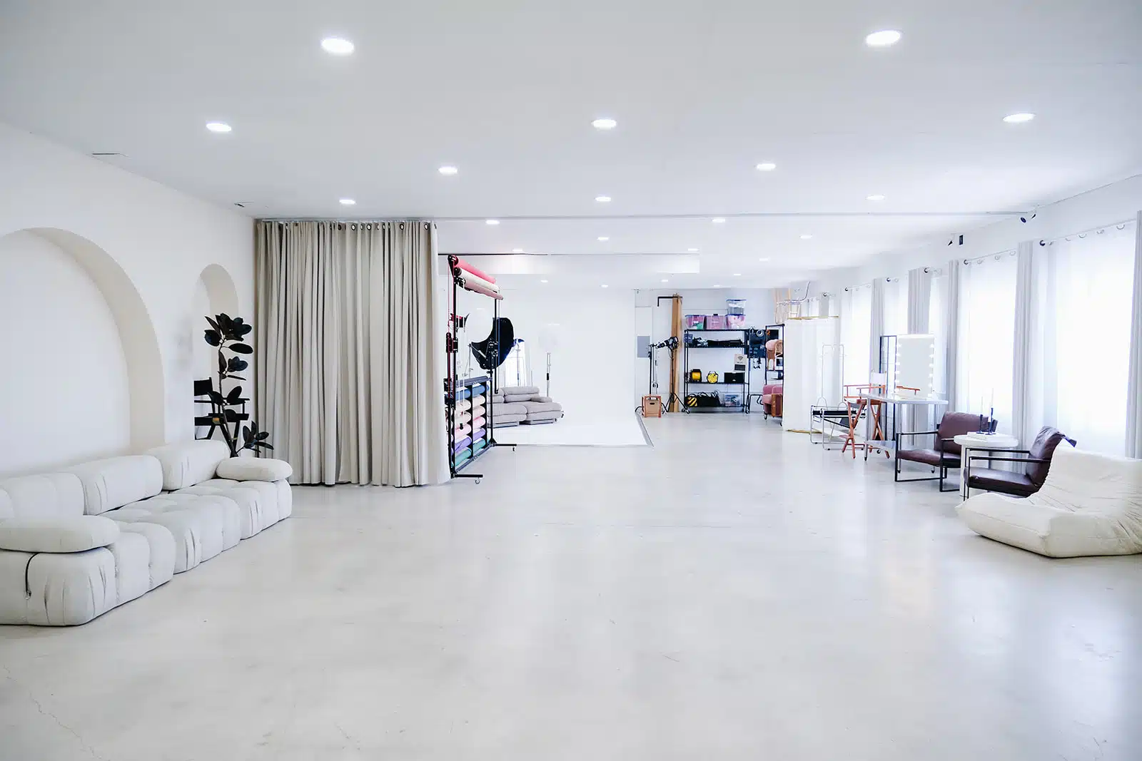 Arch wall set with a neutral backdrop inside a private Miami photo studio